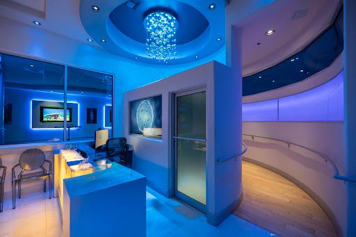 Focus Brain Therapy facility showing cognitive training equipment and screens